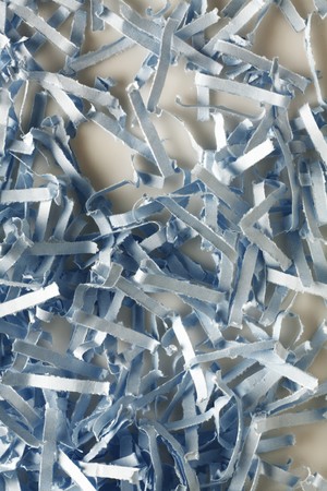 close up detail image of sheredded blue paper