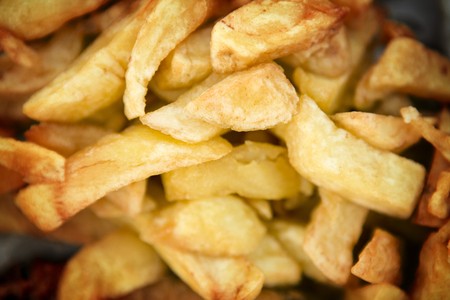 look down at chips bought from a chip shop in englandの写真素材