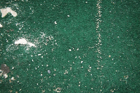 close up detail shot, looking down at a well used piece of sand paper の写真素材