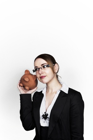 business woman holding a piggy bankの写真素材