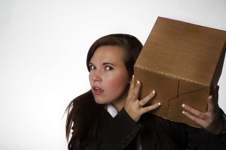woman holding a card board boxの写真素材
