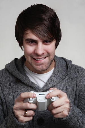 young guy playing a video game