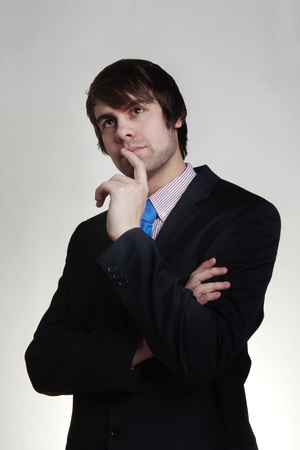 business man thinking looks deep in thoughtの写真素材