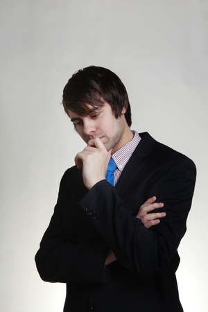 business man thinking looks deep in thoughtの写真素材