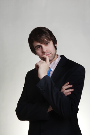 business man thinking looks deep in thoughtの写真素材