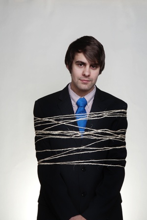 businessman tie up with string around his bodyの写真素材