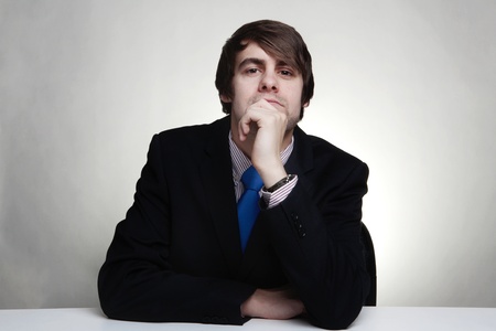 business man thinking looks deep in thoughtの写真素材
