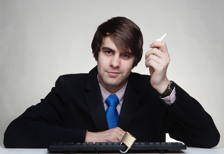 businessman with a padlock on his keyboardの写真素材