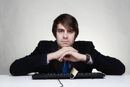 businessman with a padlock on his keyboardの写真素材