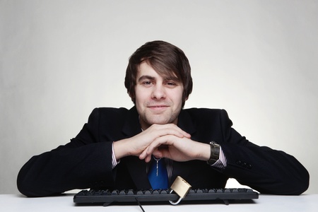 businessman with a padlock on his keyboardの写真素材