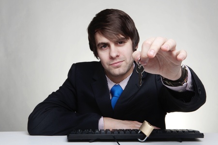 businessman with a padlock on his keyboardの写真素材