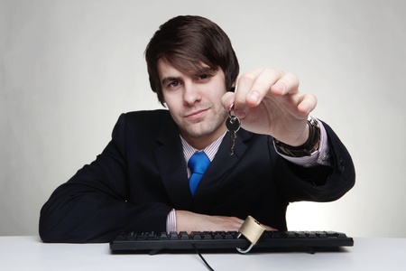 businessman with a padlock on his keyboardの写真素材