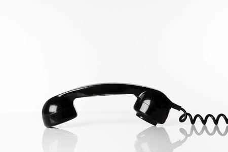 still life image of a telephone shot on a white background showing just the receiverの写真素材