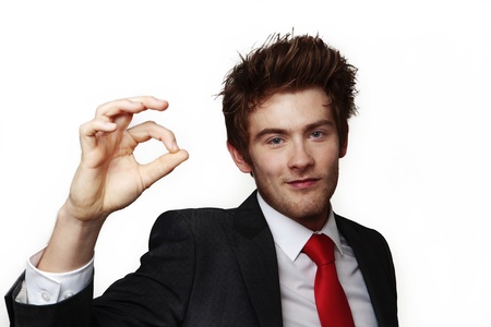 businessman doing the ok sign with his hand to let you know all is goodの写真素材