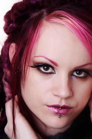 woman with dread lock hair looking at cameraの写真素材