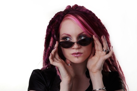 woman with dread lock hair wearing dark sun glasses の写真素材