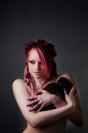 naked woman holding a hot water bottle to keep her warm and to cover up her lady bitsの写真素材