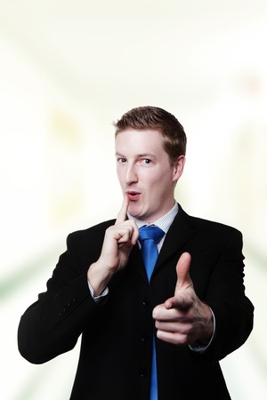 office working point his fingers as if he's got a gun and hes about to shoot youの写真素材