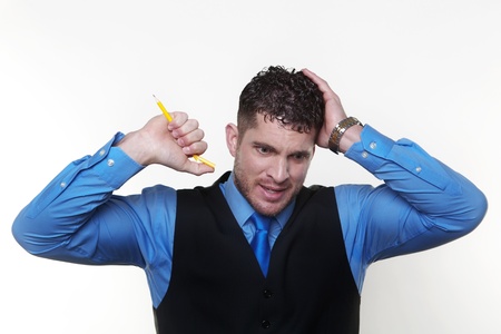 stressed out businessman breaking pencil. in need of stress managementの写真素材