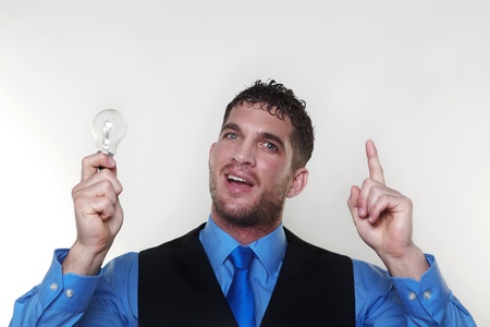 handsome man holding a light bulb in his hand 