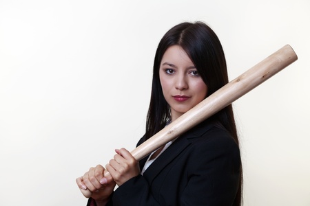 business woman holding a base ball bat not someone to mess with in businessの写真素材
