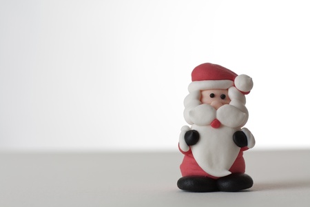 christmas santa claus icing cake decoration ready to be but on top of a cakeの写真素材