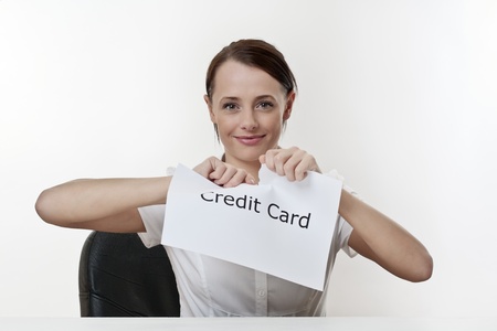 woman sitting at a desk getting rid of her credit card worriesの写真素材