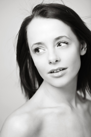 beautiful smiling girl shot in the studio with her hair blowing around her faceの写真素材
