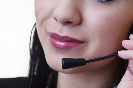 close up of a woman mouth using a phone headset to talkの写真素材