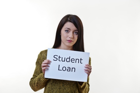 woman holding up a piece of paper with the words student loan written on it and tearing the sheet of...