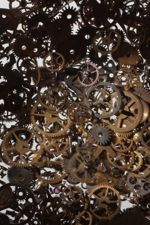 many parts and cog from a watch looking down from above backgroundの写真素材