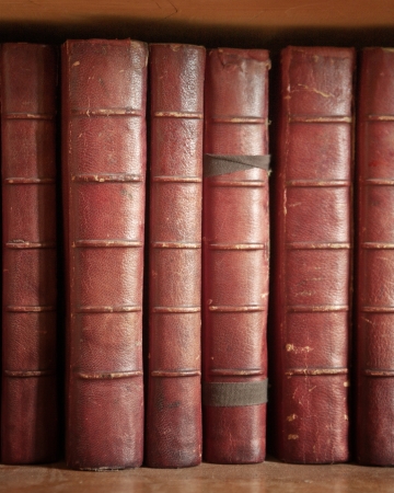 bookcase with many old books in a  libraryの写真素材