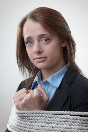 bound by rope businesswoman tied maybe for a corporate crime の写真素材
