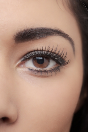 attractive head shot of asian woman shot in the studio looking at cameraの写真素材