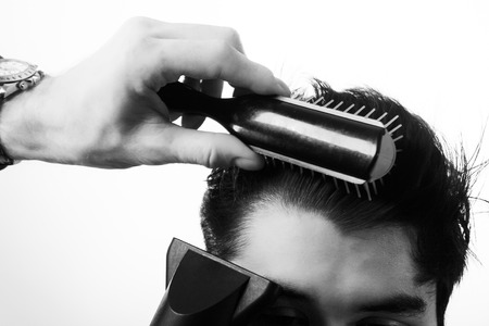 close up shot of man getting his hair cut