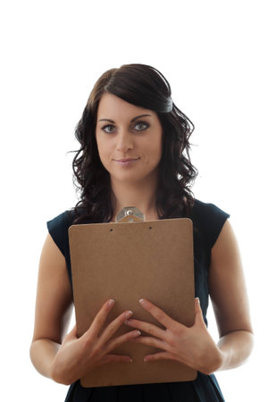 Portrait of an elegant young businesswoman with clipboardの写真素材