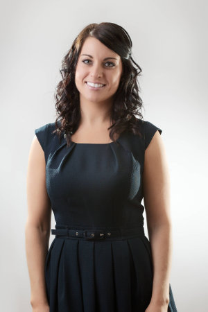 Smiling standing  businesswoman looking at cameraの写真素材