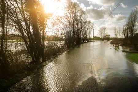 large downpour of rain has flooded the roads in essex englandの写真素材