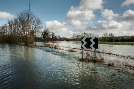 large downpour of rain has flooded the roads in essex englandの写真素材