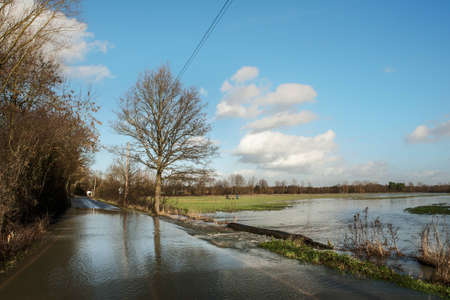 large downpour of rain has flooded the roads in essex england