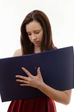 woman taking notes in a ring folderの写真素材
