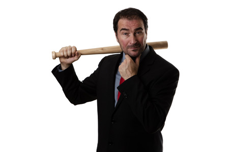 Business man holding a baseball batの写真素材