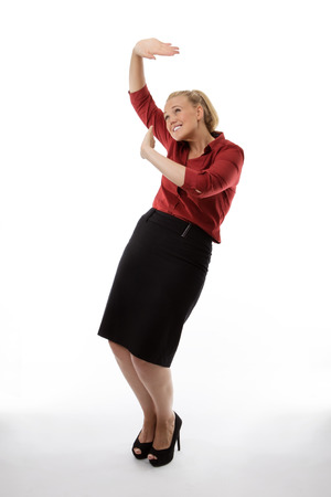 standing business woman protecting herself from falling objectsの写真素材