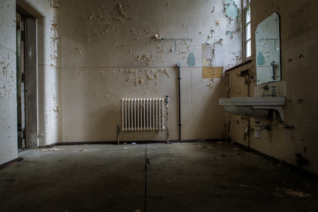 inside view of a deserted room with an old radiatorの写真素材