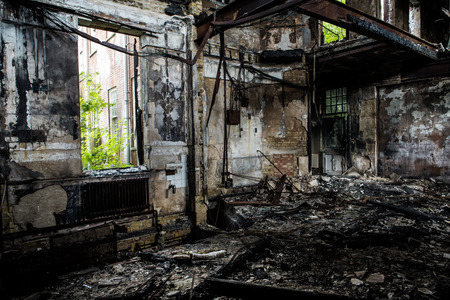 inside view of a deserted run down building after a fireの写真素材