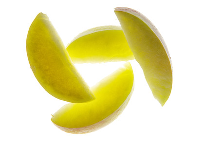 apple pieces, cut out shot on white background lit from bellowの写真素材