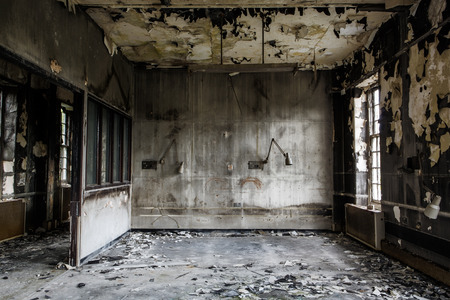 inside view of a deserted run down building after a fire