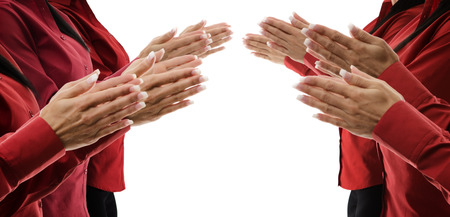 row of female hands clapping
