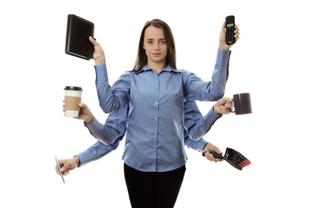 busy woman with many arms multitasking conceptの写真素材