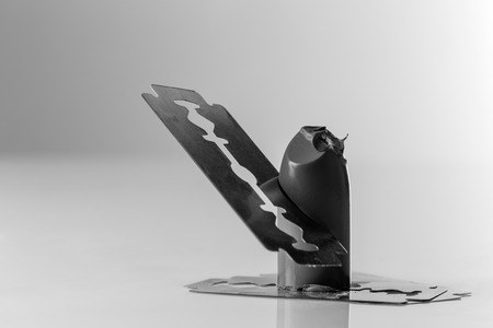 lip stick cut up with razer blade shot in the studio on white perspex backgroundの写真素材